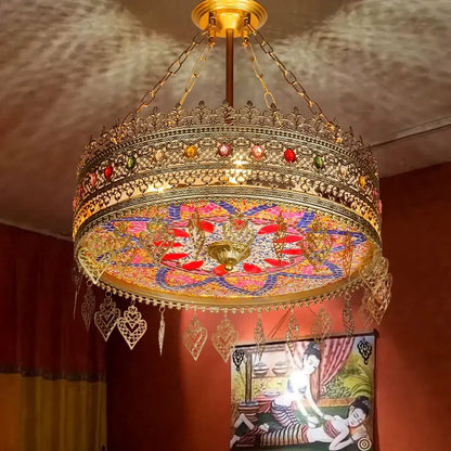 Ornate gold-toned pendant lights with intricate filigree and bohemian exotic stained glass for dining room decorbites bohemian exotic