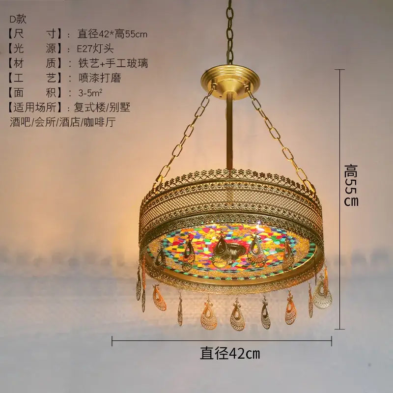 Gold-toned ornate pendant lights with intricate metalwork and bohemian exotic stained glass peacock decorbites design for dining room