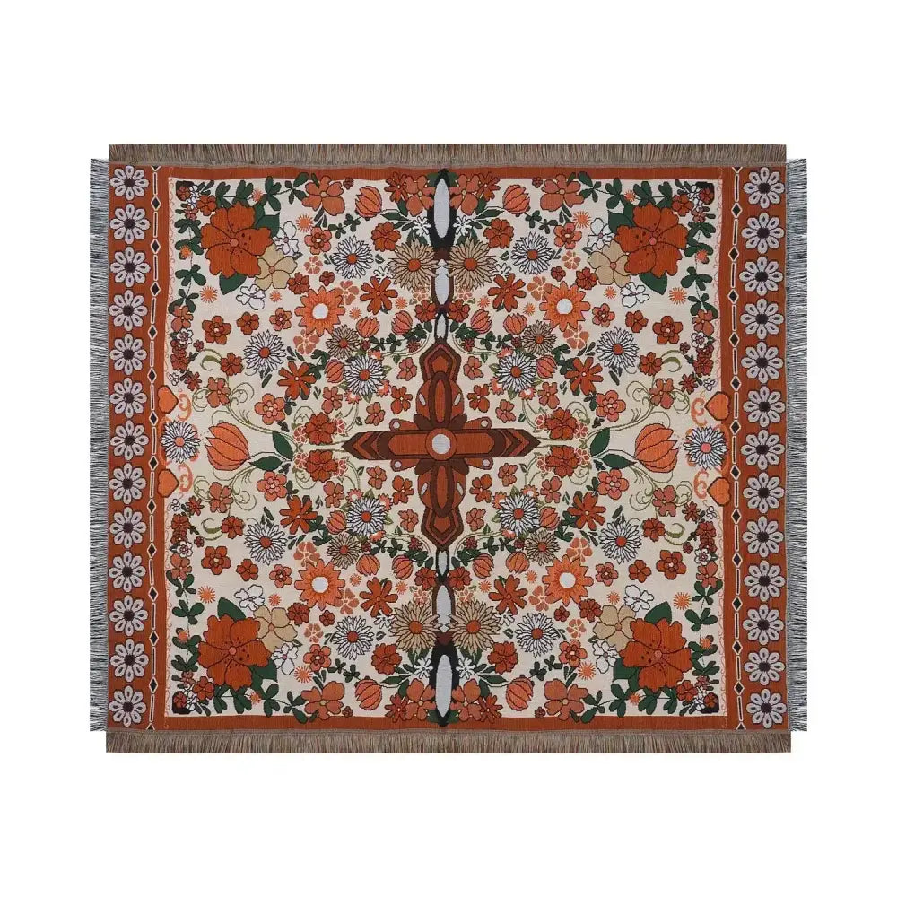 A decorbites bohemian floral leisure blanket with vibrant orange cream and green floral pattern and fringed edges