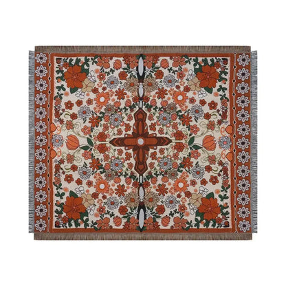 A decorbites bohemian floral leisure blanket with vibrant orange cream and green floral pattern and fringed edges