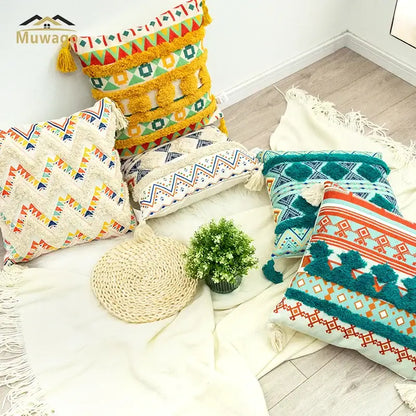 Vibrant bohemian floral throw pillow cover with geometric patterns and tassels in yellow teal orange and cream by decorbites