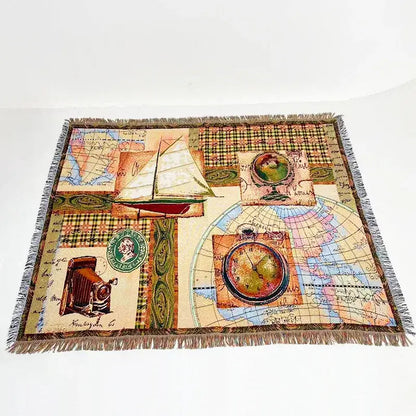 Bohemian jacquard sofa blanket featuring vintage woven patchwork with maps and nautical elements in earthy tones