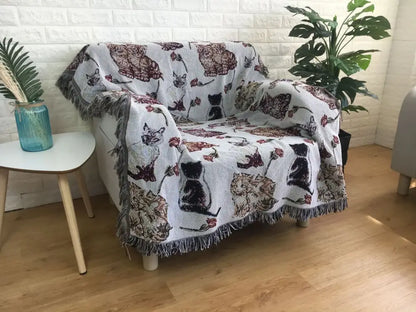 White woven bohemian jacquard sofa blanket with embroidered cat floral patterns and fringed edges for autumn living room