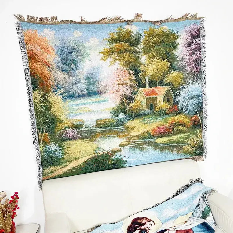 Bohemian jacquard sofa blanket featuring a woven pastoral autumn scene with trees cottage and river under blue sky