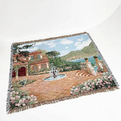 Bohemian jacquard sofa blanket featuring a woven mediterranean courtyard with terracotta roofs and pink roses design