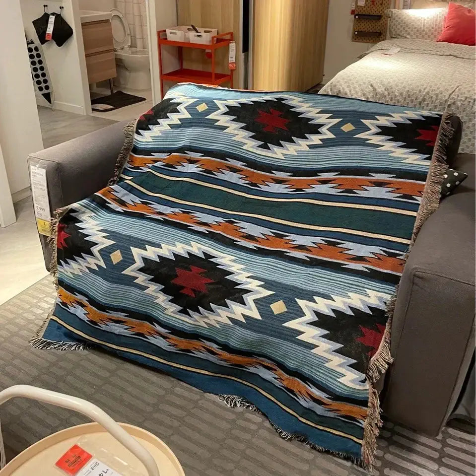Vibrant bohemian knit throw blanket with blue red geometric patterns and fringed edges for decorbites living room decor