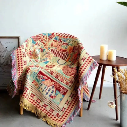 A cozy multicolored woven decorbites bohemian knitted sofa cover with patchwork design in earth tone colors