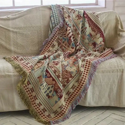Cozy earth tone decorbites bohemian knitted sofa cover with multicolored geometric and floral patterns featuring fringed edges