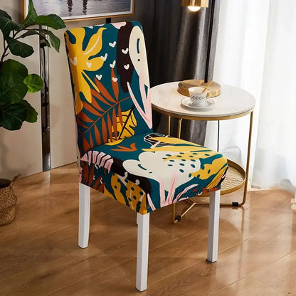 Vibrant tropical-themed bohemian mandala stretch chair cover in teal yellow and pink with leafy patterns for dining room decor