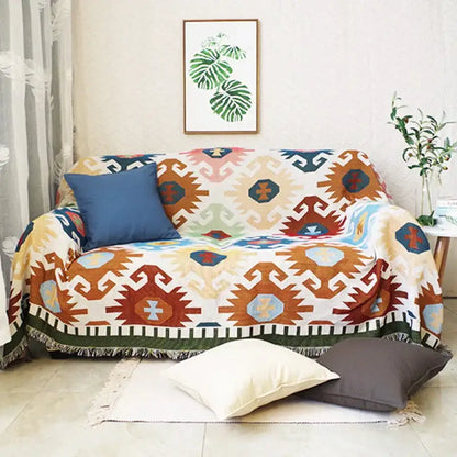 Bohemian multicolored geometric tassel sofa cover in warm earth tones with tribal-inspired decorbites geometric tassel design
