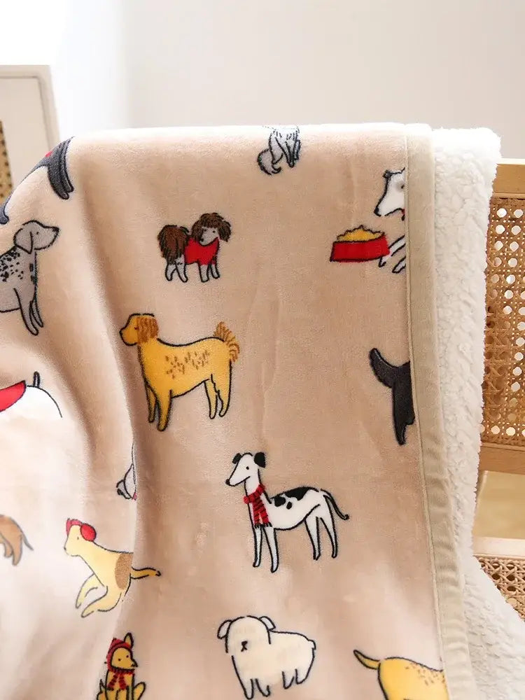 Beige plush sofa blanket with playful cartoon dogs pattern in multicolored winter coral fleece for living room use