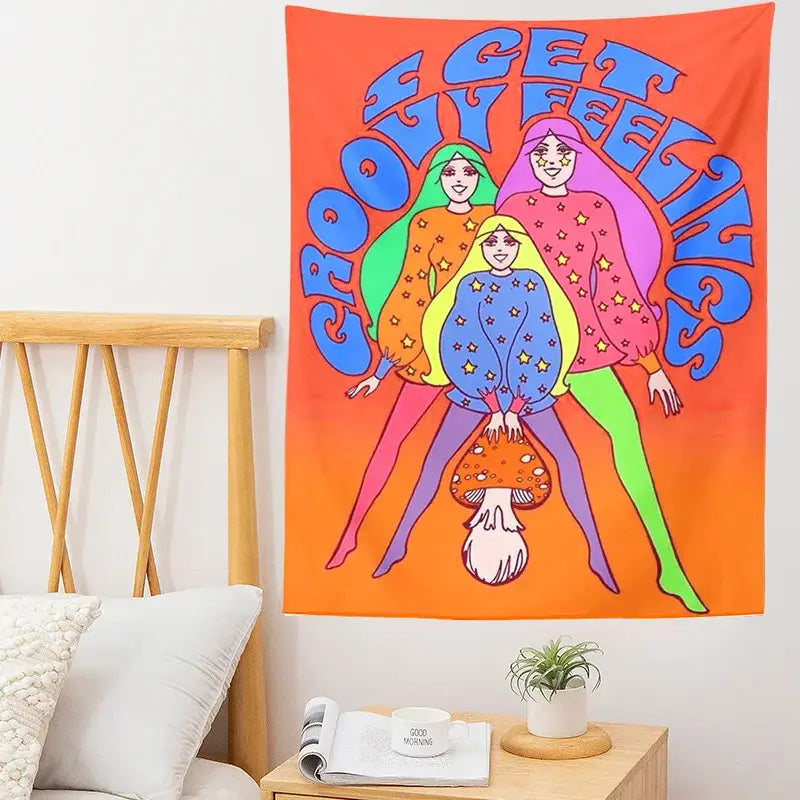 Vibrant orange bohemian mushroom girl tapestry featuring three stylized women in star-patterned sweaters decorbites wall art