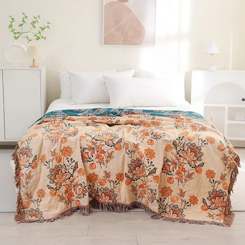 Beige floral decorbites bohemian sofa blanket with orange and teal blossoms and textured fringe for living room decor