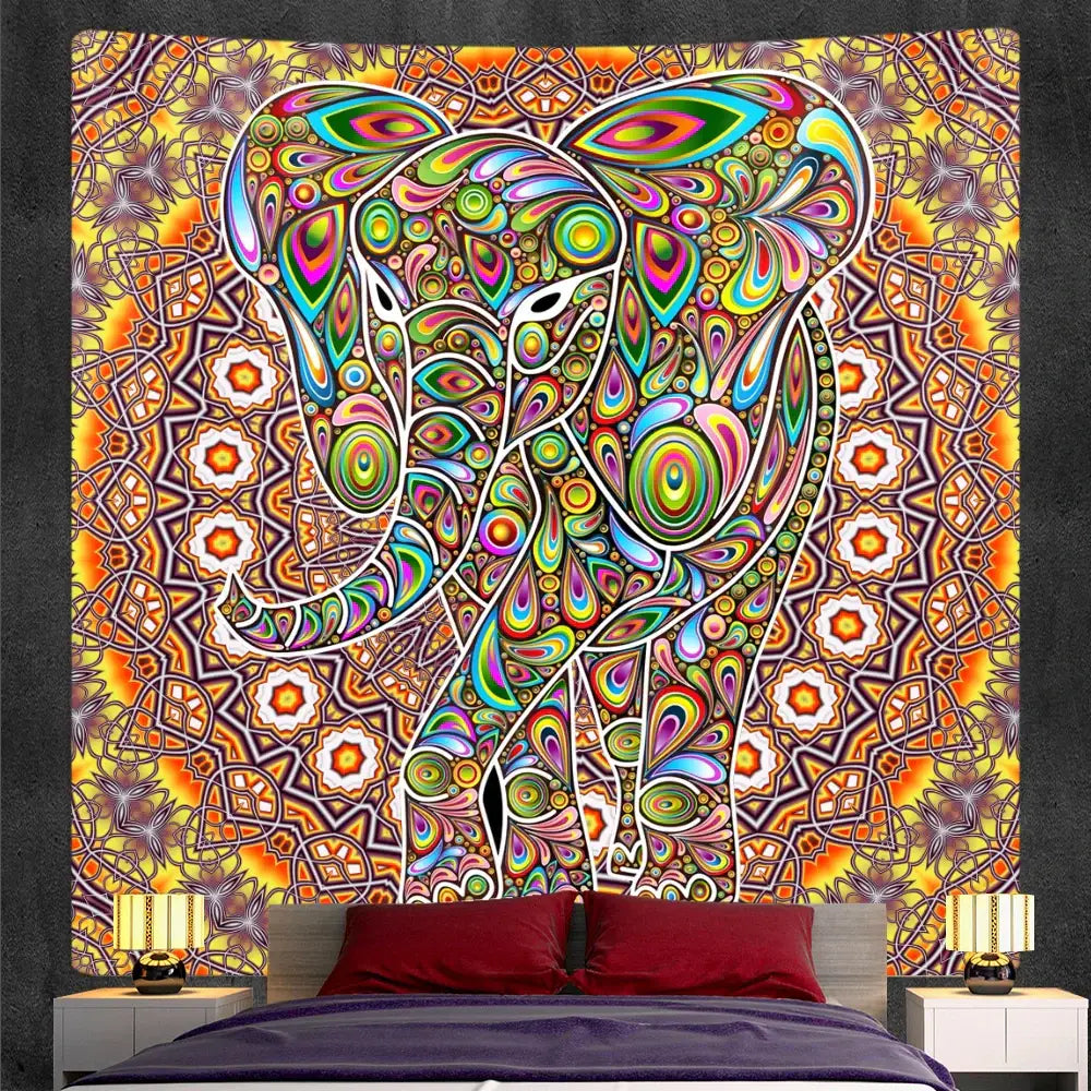 Bohemian purple and pink elephant god mandala tapestry with vibrant rainbow hues and glowing orange-yellow background decorbites elephant god decor