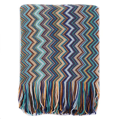 Bohemian stripe throw blanket with bold teal blue brown zigzag knit pattern and matching fringe for living room decorbites