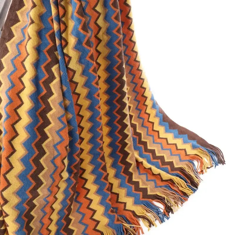 Bohemian stripe throw blanket with vibrant zigzag pattern in yellow blue orange and brown featuring fringed edge decorbites bohemian stripe