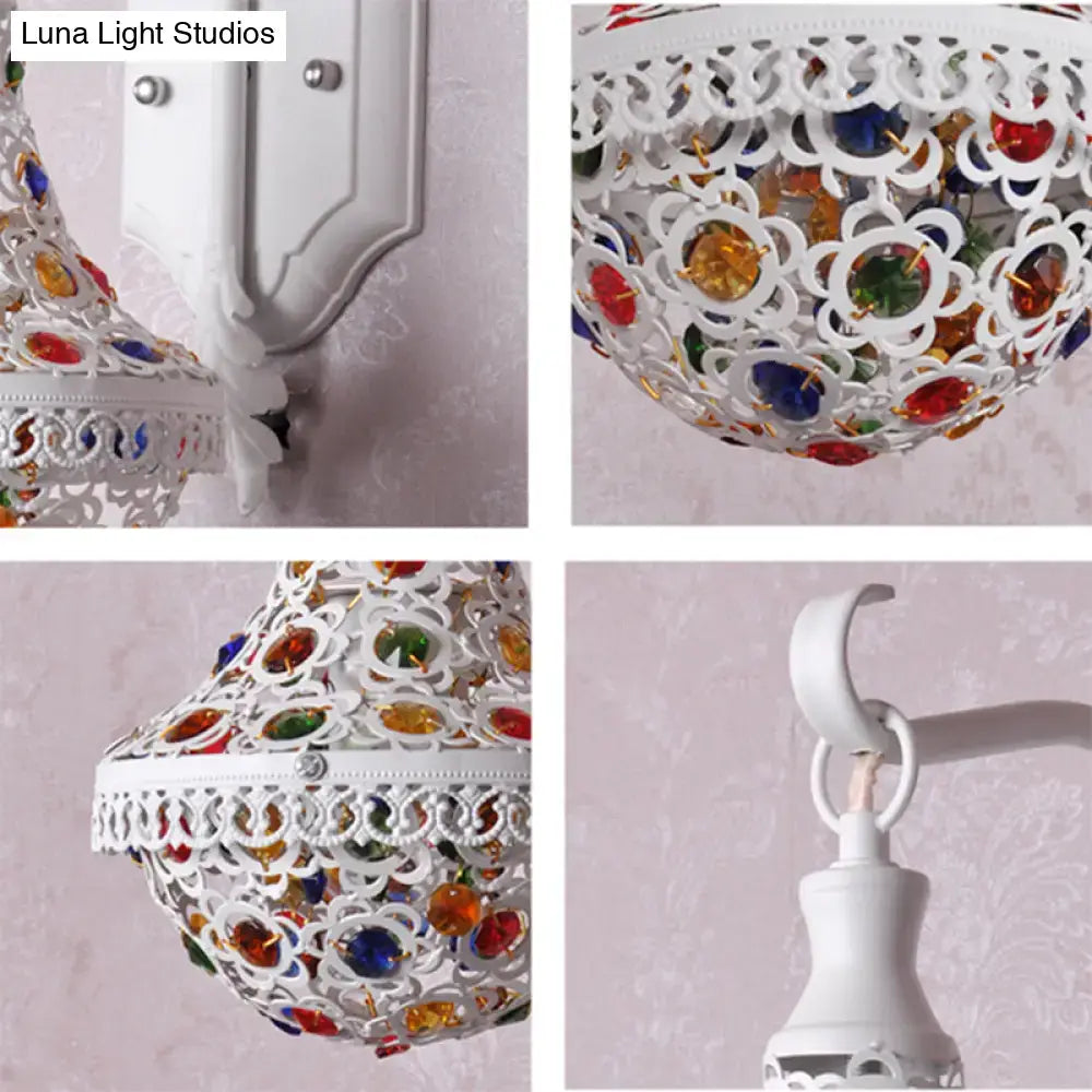 White finish ornate metal lantern with colorful glass gemstones in floral cutouts for bohemian bedroom lighting