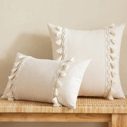 Cream-colored rectangular cushion cover with tasseled trim in decorbites beige boho style for living room decor
