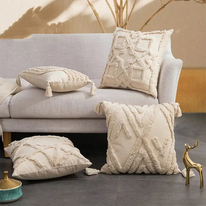 Cream-colored cushion cover with textured fringed geometric patterns and tassels for decorbites beige boho style decor