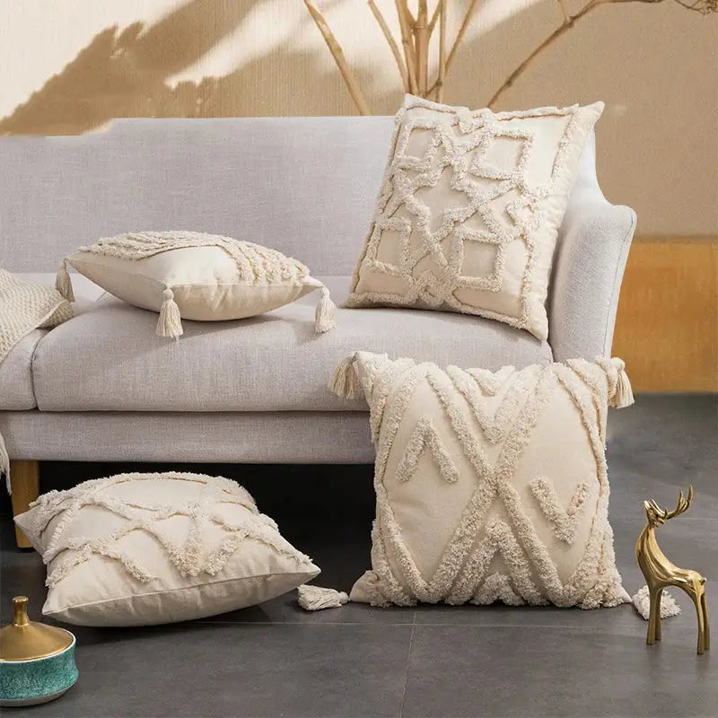 Cream-colored cushion cover with textured fringed geometric patterns and tassels for decorbites beige boho style decor