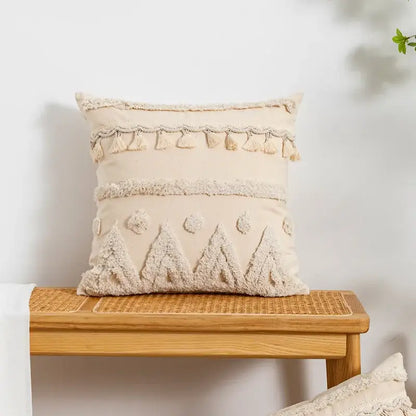 Cream-colored tasseled cushion cover with textured embroidered tree motifs for decorbites beige boho living room decorbites beige boho cushion cover with textured tree embroidery and tassel trim in cream color for beige boho style living room decor