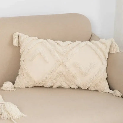 Cream-colored rectangular cushion cover boho beige style with textured fringed fabric and tassels for living room decorbites