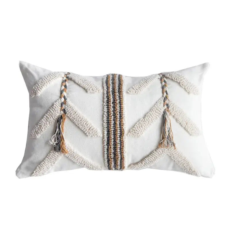 White rectangular tufted pillow cover with braided tassels and beige brown gray geometric woven pattern for living room