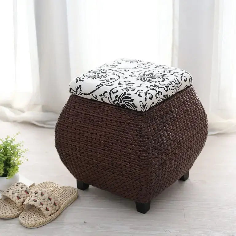 Brown woven rattan 3-in-1 storage stool with white lid featuring black floral embroidery for bedroom footrest