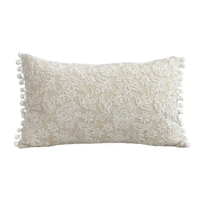 Beige linen cotton pillow cover with white floral lace embroidery and pom-pom trim for boho living room decor