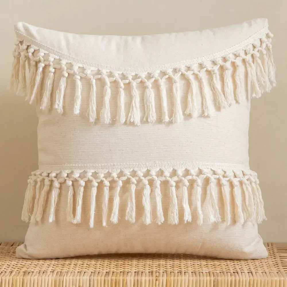 Cream-colored linen cotton pillow cover with hand-knotted macrame tassels for boho living room decor