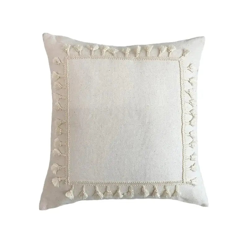Cream-colored boho linen cotton pillow cover with textured fabric and decorative tassels for living room decor