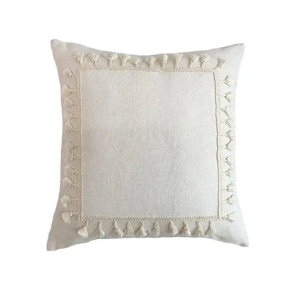 Cream-colored boho linen cotton pillow cover with textured fabric and decorative tassels for living room decor