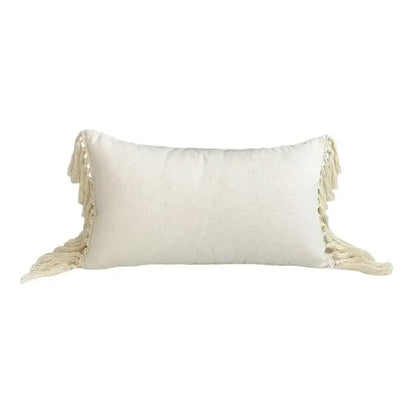 Cream-colored rectangular pillow cover with textured linen cotton fabric and decorative tassels for living room decor