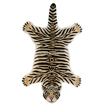 A plush cream-colored rug with black tiger stripes and detailed face resembling a boho black bear rug decorbites boho black