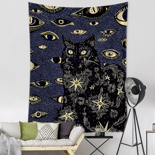 Boho black and gold cat eyes tapestry featuring a central cat with eyes stars and celestial decorbites cat eyes design
