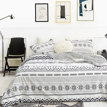 Boho chic black and white bedding set featuring geometric patterns and snowflake motifs by decorbites boho chic