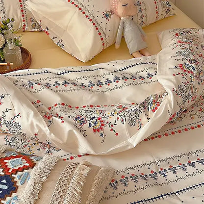 Cream-colored satin duvet cover with intricate red blue and black floral embroidery in decorbites boho cotton printed bedding set