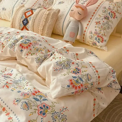 Cream-colored boho cotton printed floral bedding set with embroidered red orange and blue blossoms for bedroom decor