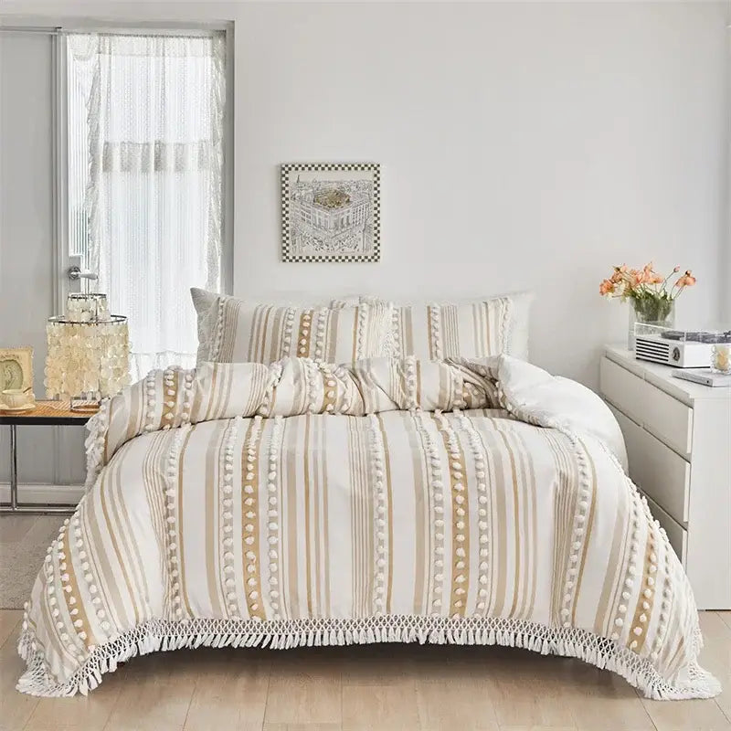 Beige and cream striped duvet set with pom pom trim and fringe detailing from decorbites boho stripe collection