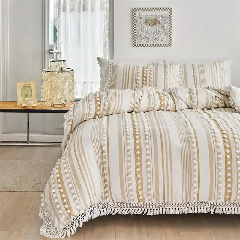 Boho cream and beige striped duvet set with white pom-pom trim and fringe detailing by decorbites boho stripe furball
