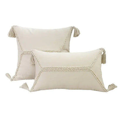 Cream-colored rectangular cushion cover with lace floral design braided rope trim and tassels for decorbites boho white decor