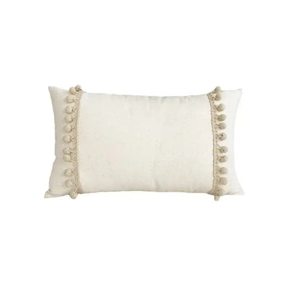 Cream-colored rectangular cushion cover with lace floral design and fluffy pom-poms by decorbites boho white