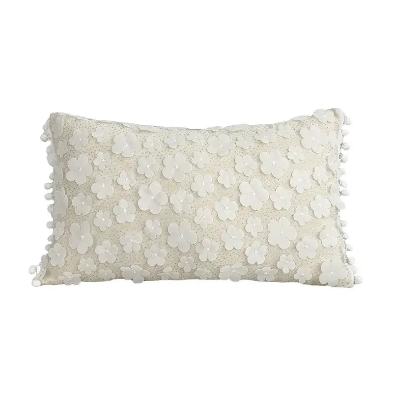 Cream-colored rectangular cushion cover with lace floral appliqués and pom pom trim decorbites boho white pillow decor