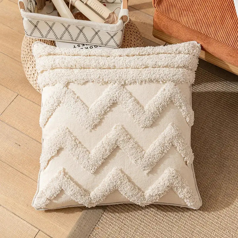 Cream-colored boho cotton pillow cover with textured fluffy zigzag and tassel decorbites boho cotton tassel design