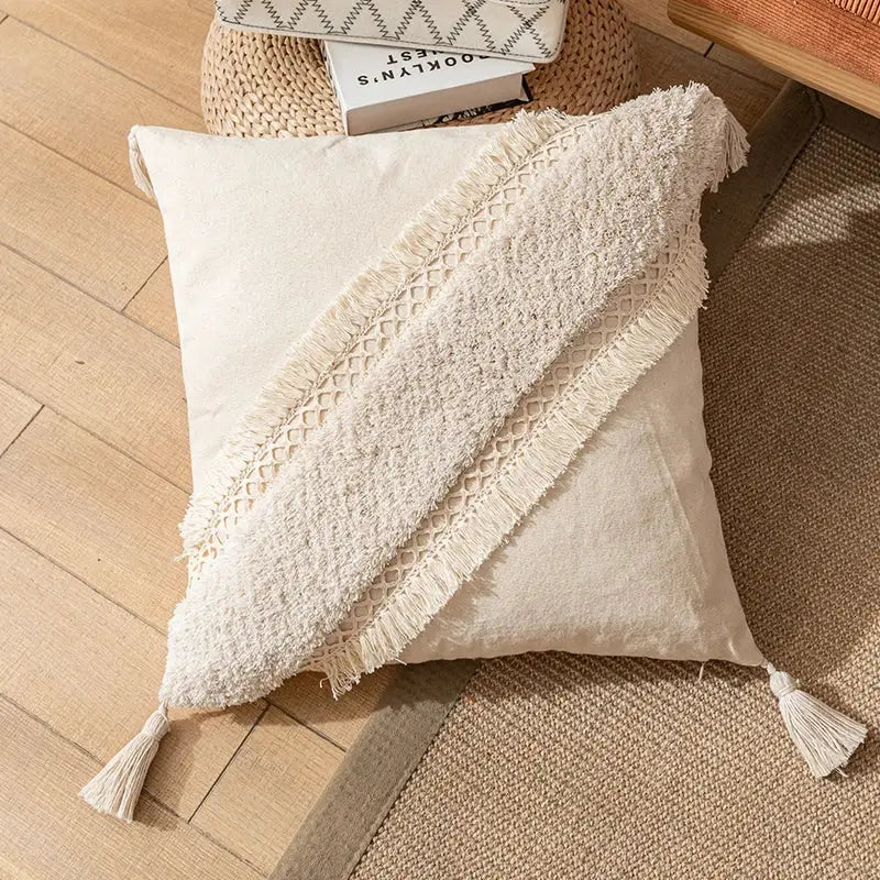 Cream-colored boho cotton pillow cover with textured fringed diagonal band and tassels for living room decorbites boho cotton tassel design