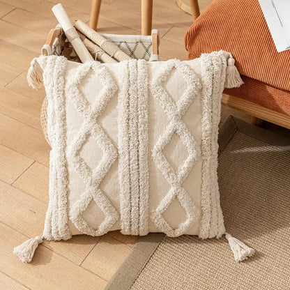 Cream-colored boho cotton tassel pillow cover with textured diamond pattern and fringe corners for living room decorbites decor