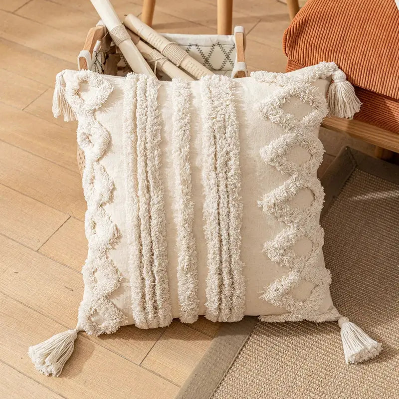 Cream-colored boho cotton pillow cover with textured fabric, fringed stripes, and tassels for decorbites boho cotton tassel decor