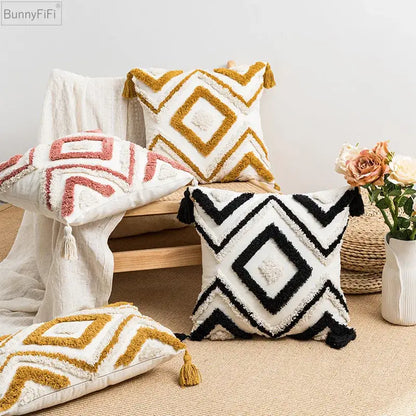 White cushion with black geometric boho diamond pattern and tassels from decorbites boho diamond pillow covers collection