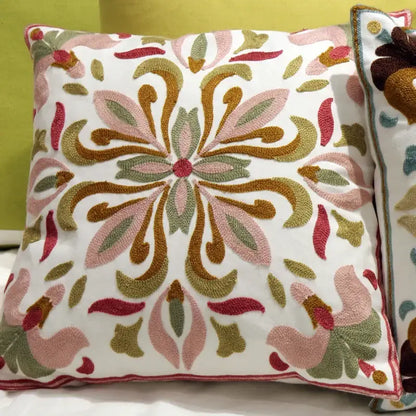 A white square flower elephant pillowcase with pink gold and olive green ethnic flower embroidery for boho decorbites decor