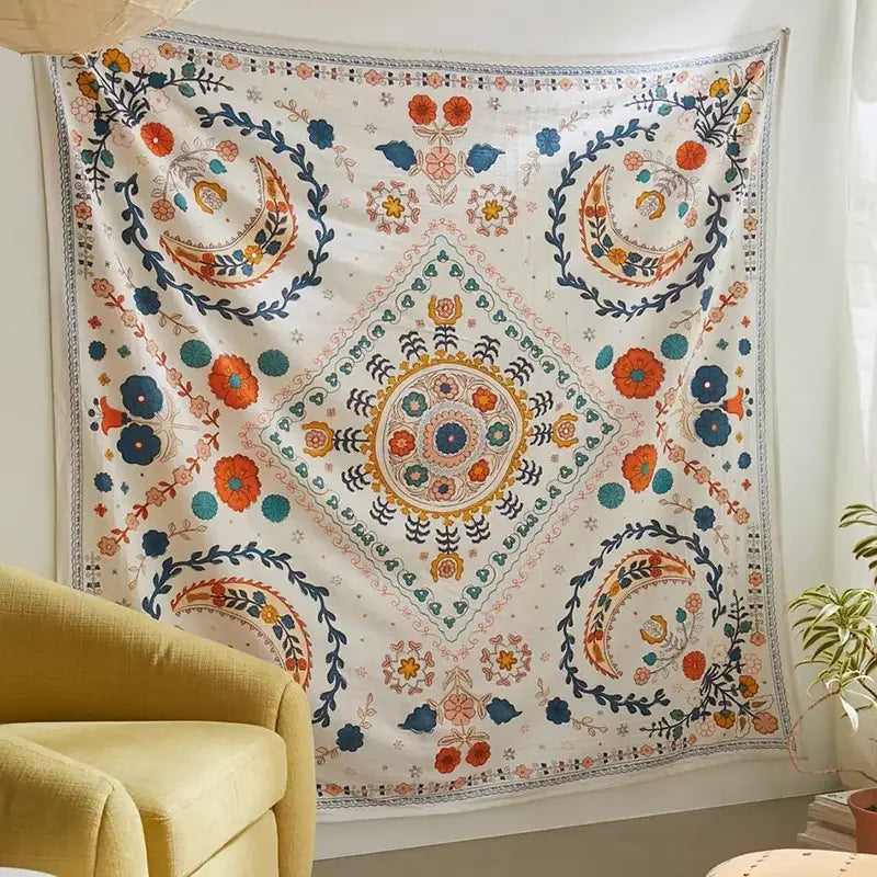 Boho floral celestial wall tapestry with vibrant embroidered diamond medallion and floral patterns in orange and blue decorbites decor